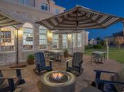 Outdoor Patio Area with Seats around Firepit