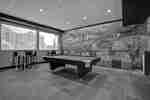 lobby lounge area with pool table and mural