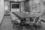 Boardroom with Table, Chairs, and Room Technology