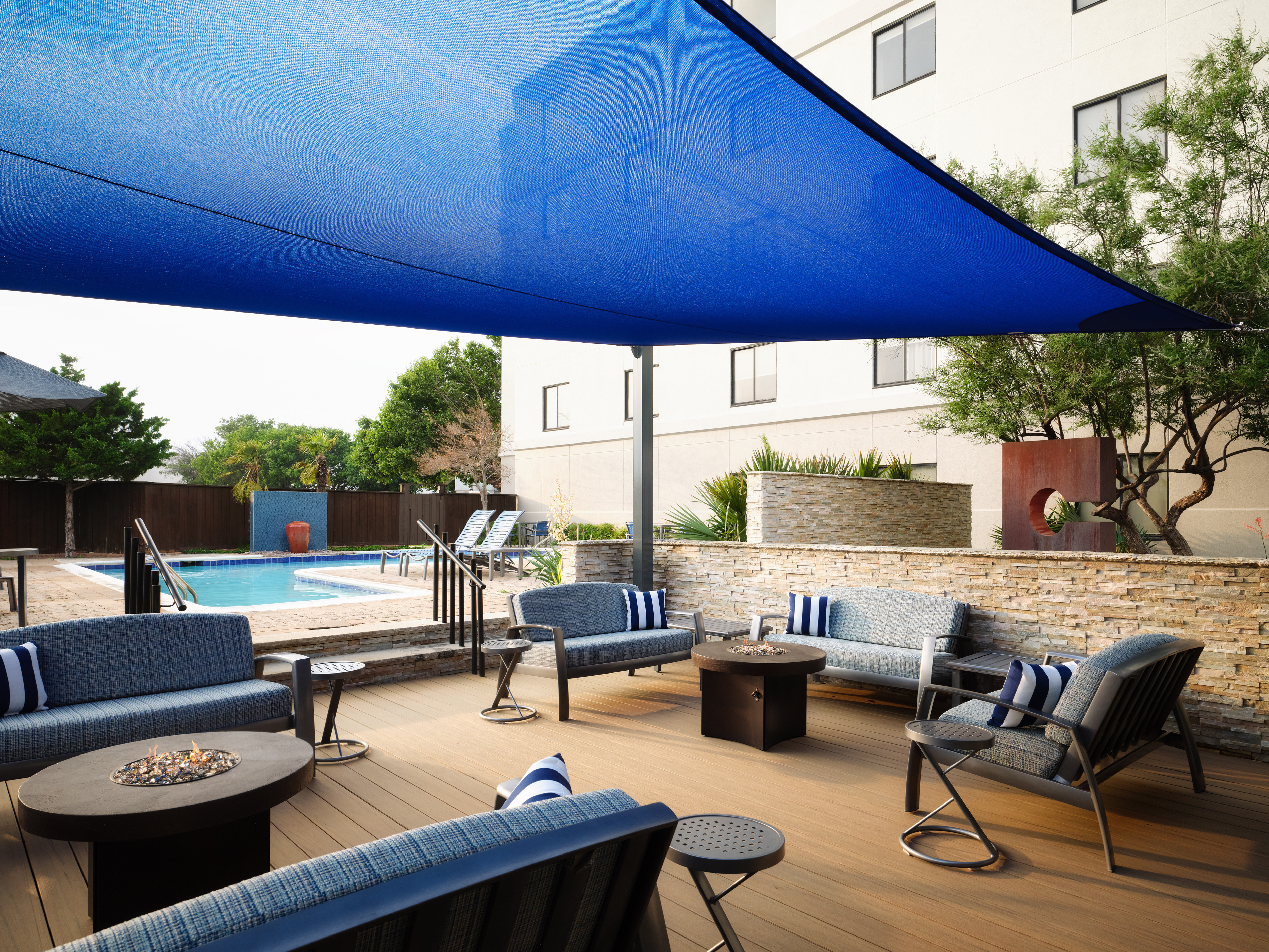 hotel patio, patio furniture, fire pit, outdoor pool
