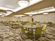 Spacious Ballroom with Roundtables and Chairs