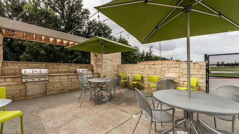 Hotel BBQ Seating Area with Chairs and Tables