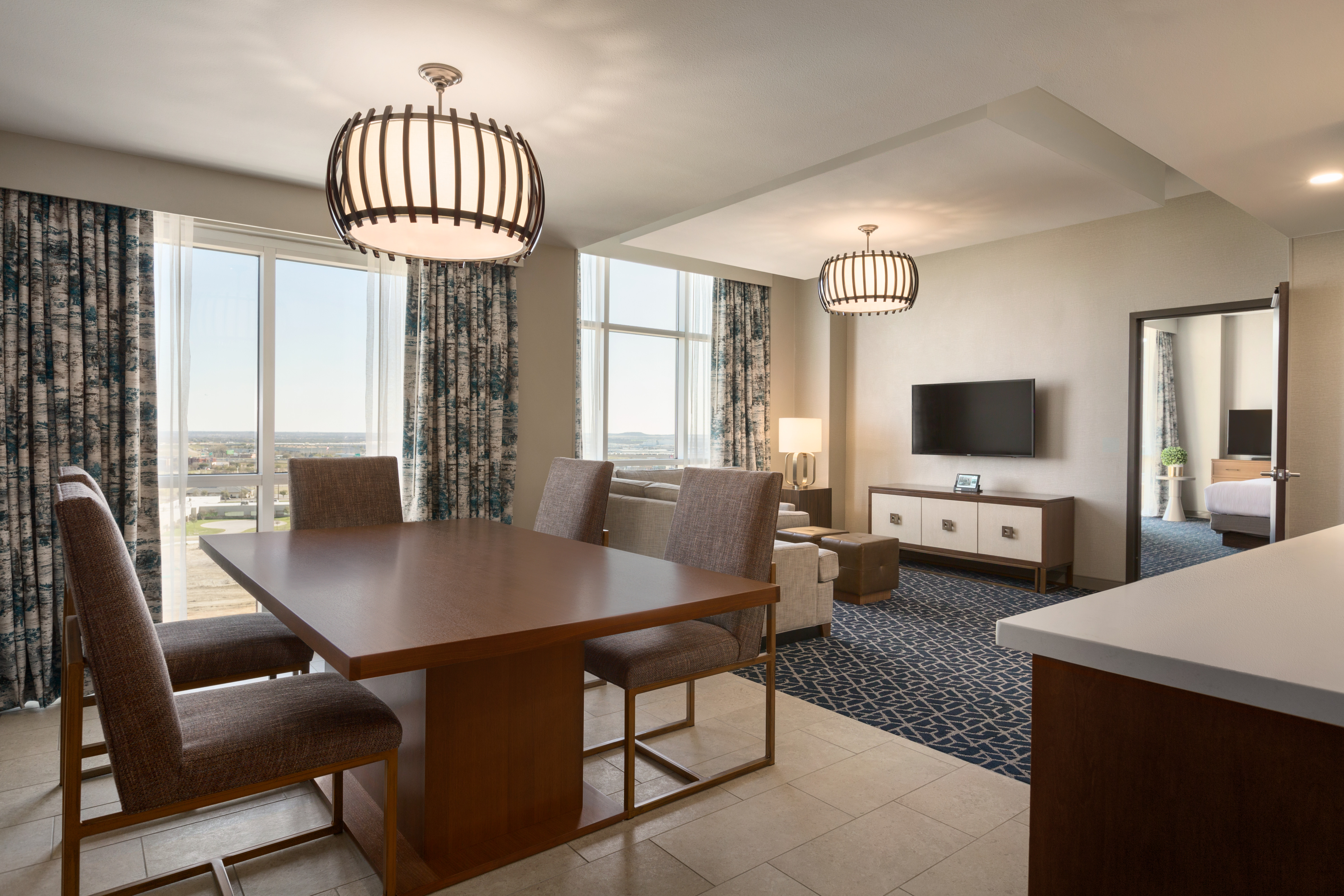 Presidential Suite Living Room Area with Sofa HDTV Table and Chairs