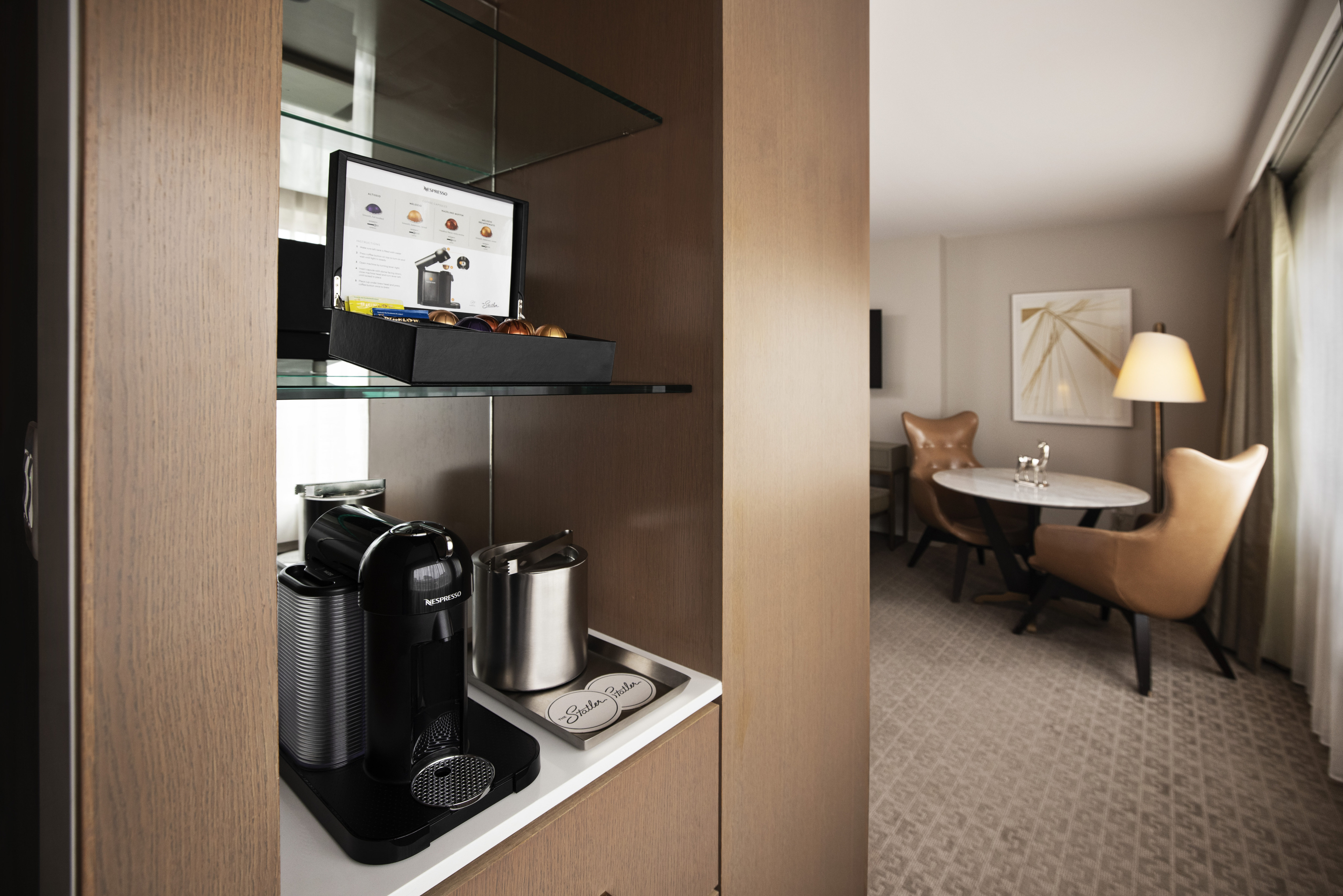 Coffeemaker with supplies and Sitting Area in Guest Room