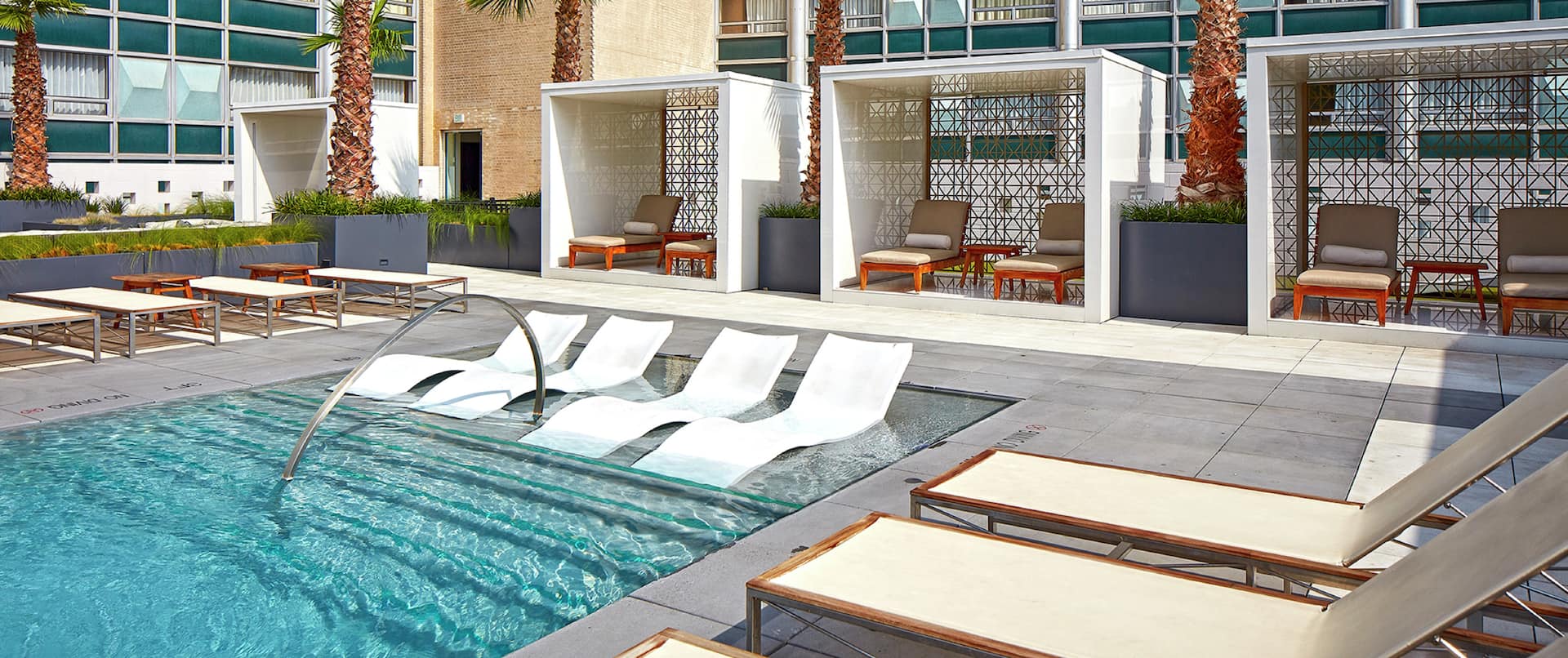 Rooftop Pool with Cabanas and Lounge Chairs