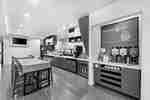 Hotel Breakfast Area with Breakfast Bar, Coffee Station, and Seating Area