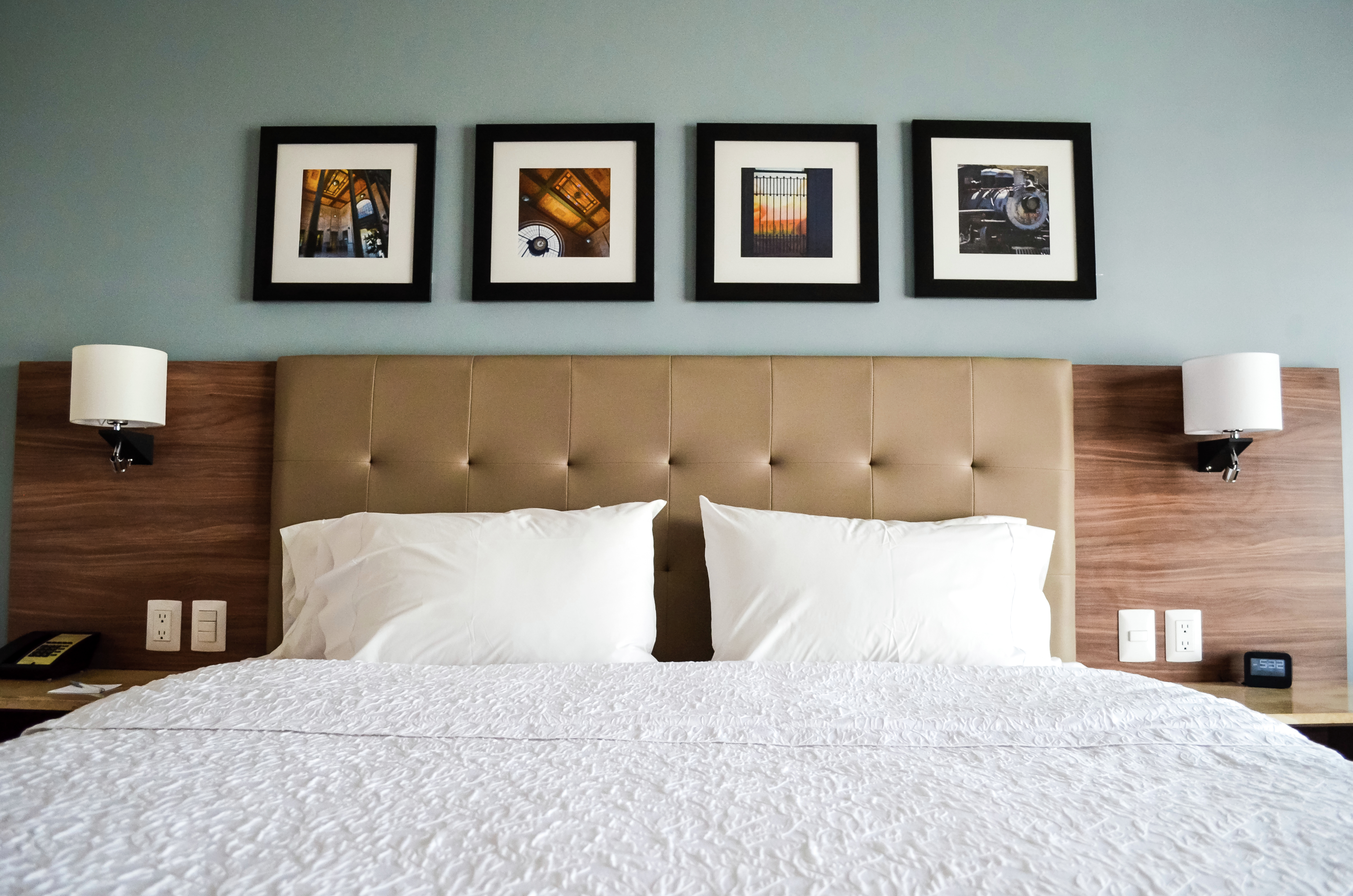 Guest Room with Luxurious King Bed and Contemporary Wall Art