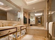 Bathroom area with mirror and bathtub
