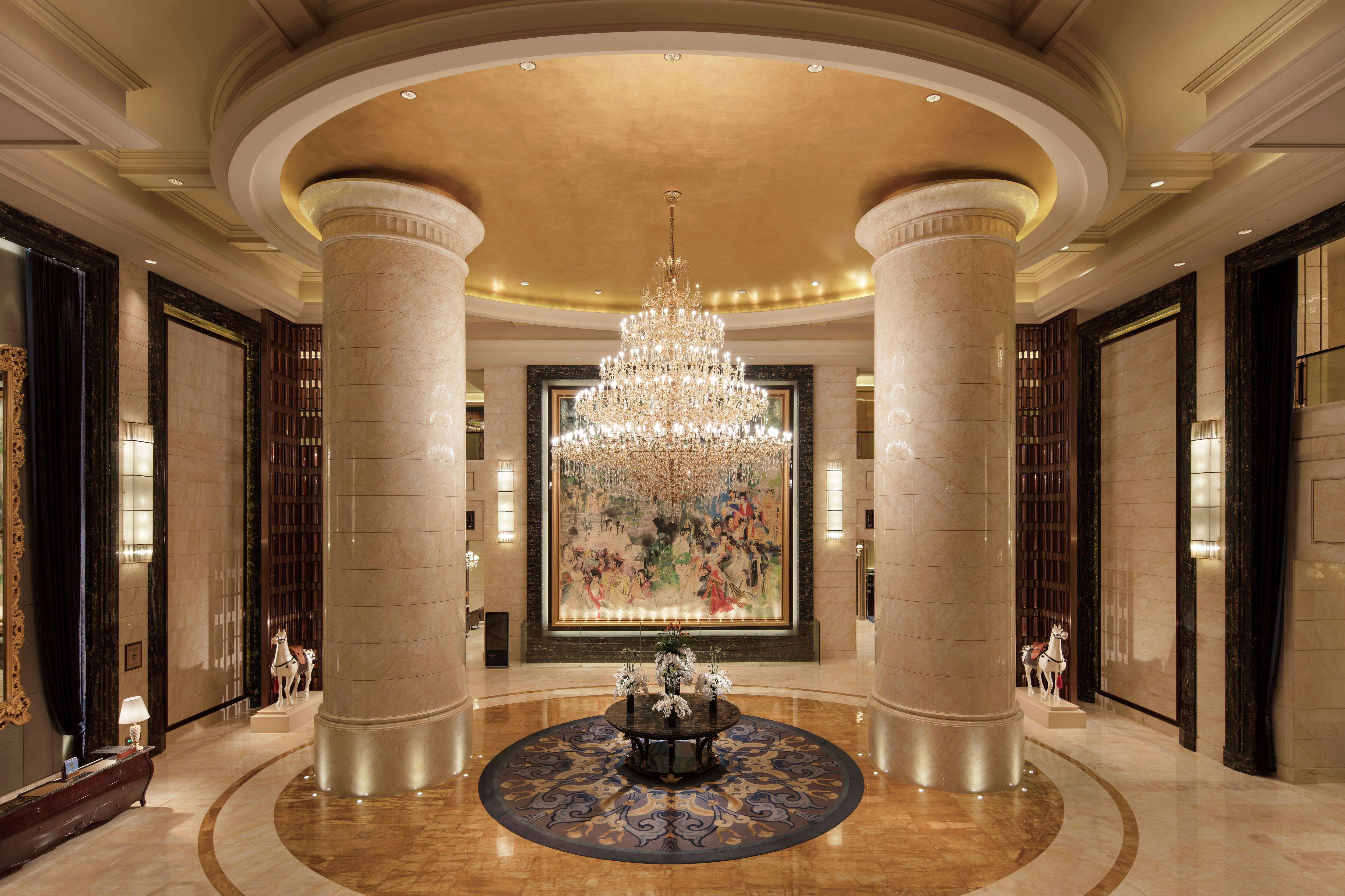 Lobby area with columns and chandelier