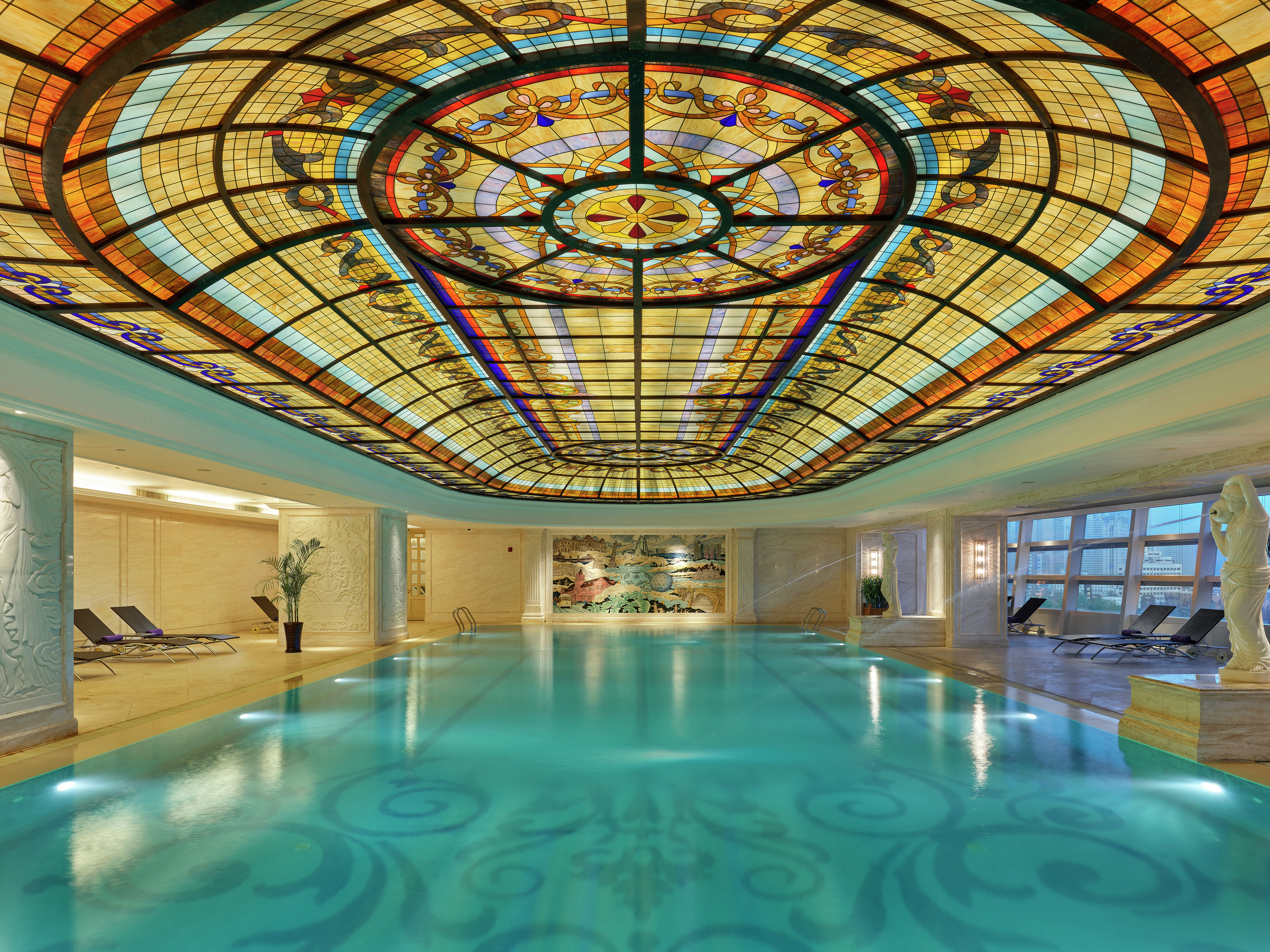 Indoor pool with ornate ceiling