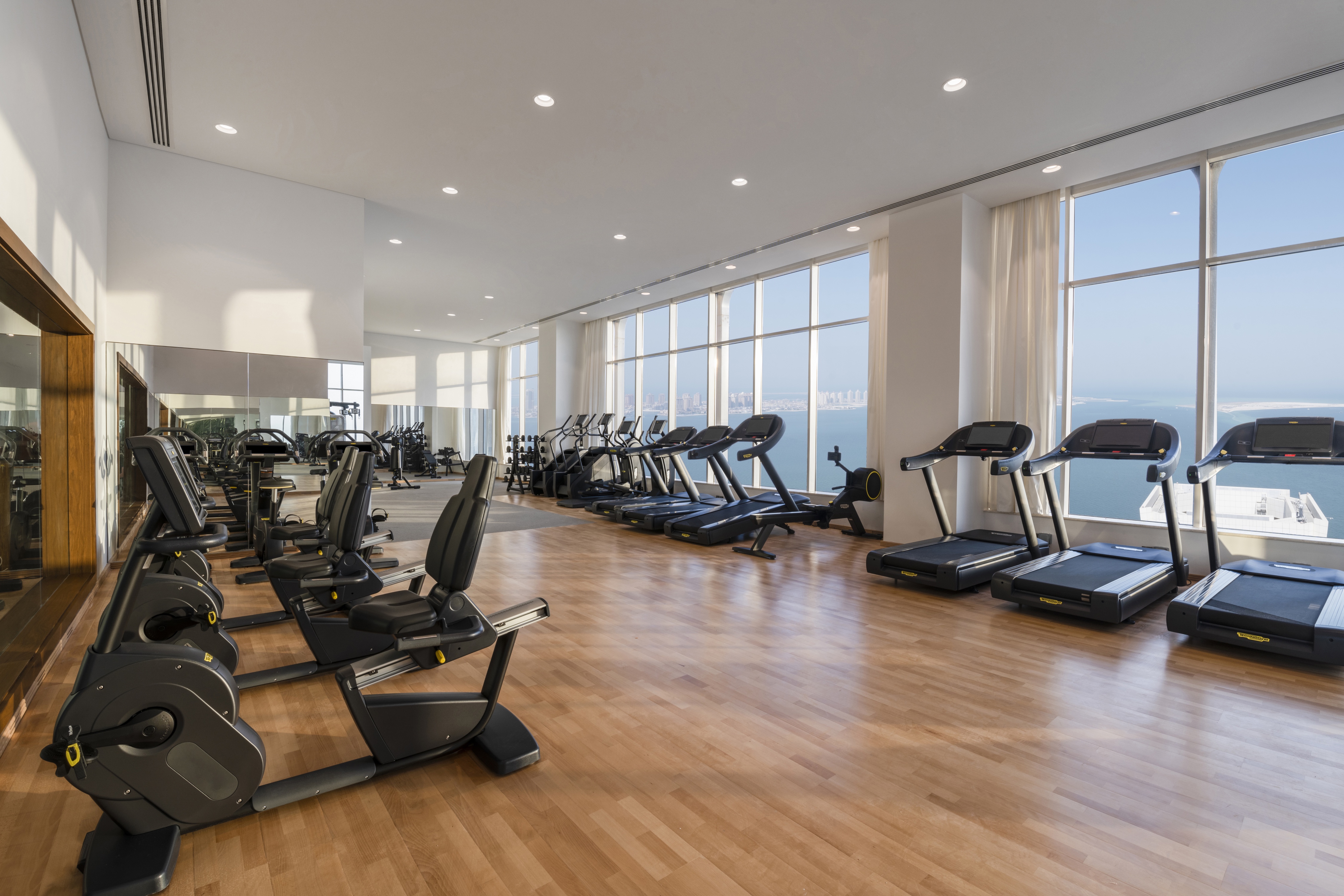 Fitness Center with Large Windows Offering Sea View