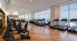 Fitness Center with Large Windows Offering Sea View