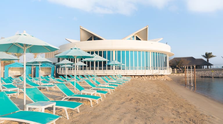Lounge Chairs under Umbrellas at the Beach