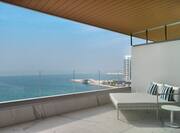 Balcony with sun lounger and sea view