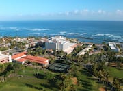 Aerial View of Hotel, Golf Course and Sea