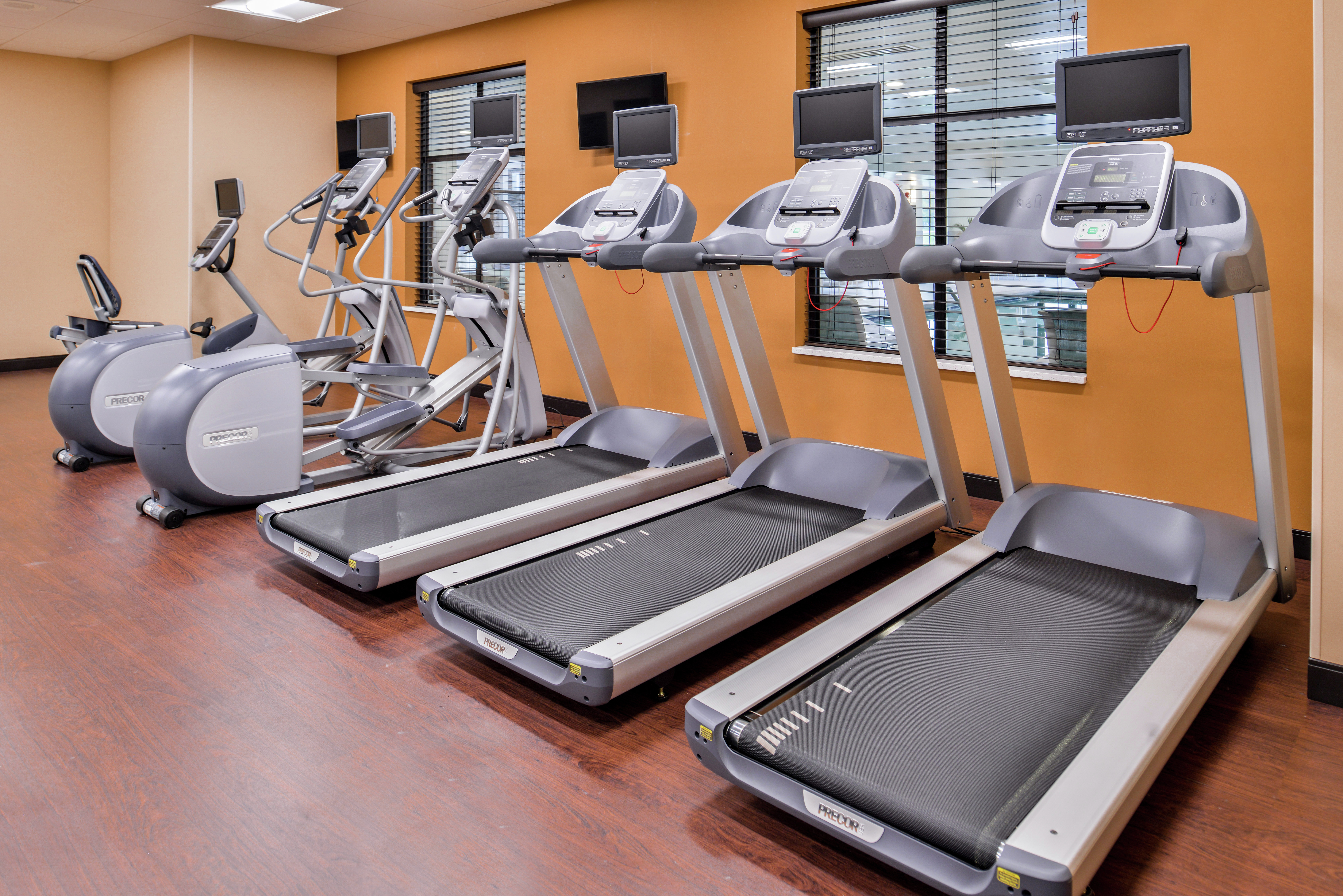 Row of Cardio Machines in Fitness Center