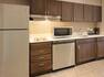 Suite Kitchen Area with Stainless Steel Appliances