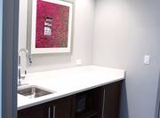 Suite wet bar with displayed wall art