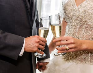 Bride and Groom with champagne glasses