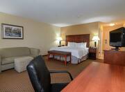 King Guestroom with Bed, Lounge Area, Work Desk, and Room Technology