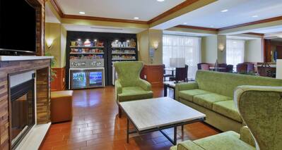 Lobby Seating Area with Fireplace and Flat Screen TV