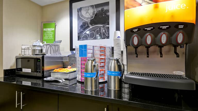 Close-Up of Breakfast Buffet Counter with Juice Machine 