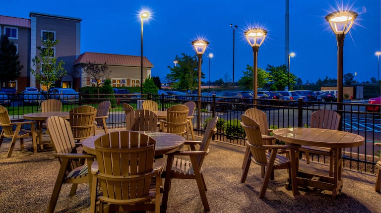 Outdoor Dining Area Deck Chairs and Table at Night