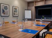 Portmarnock Meeting Room with table, chairs and tv