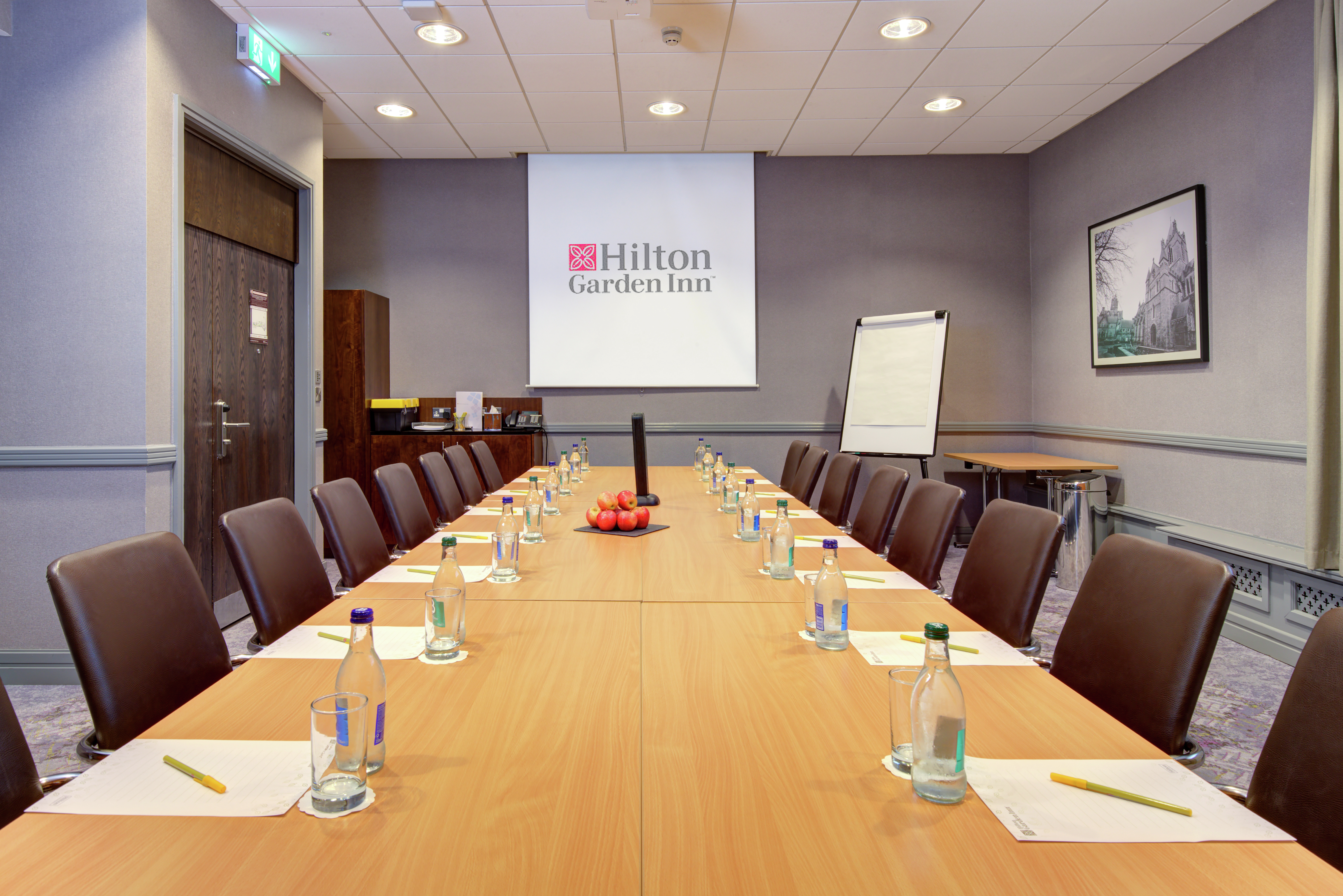Liffey Room Boardroom with Table, Chairs, and Projector Screen