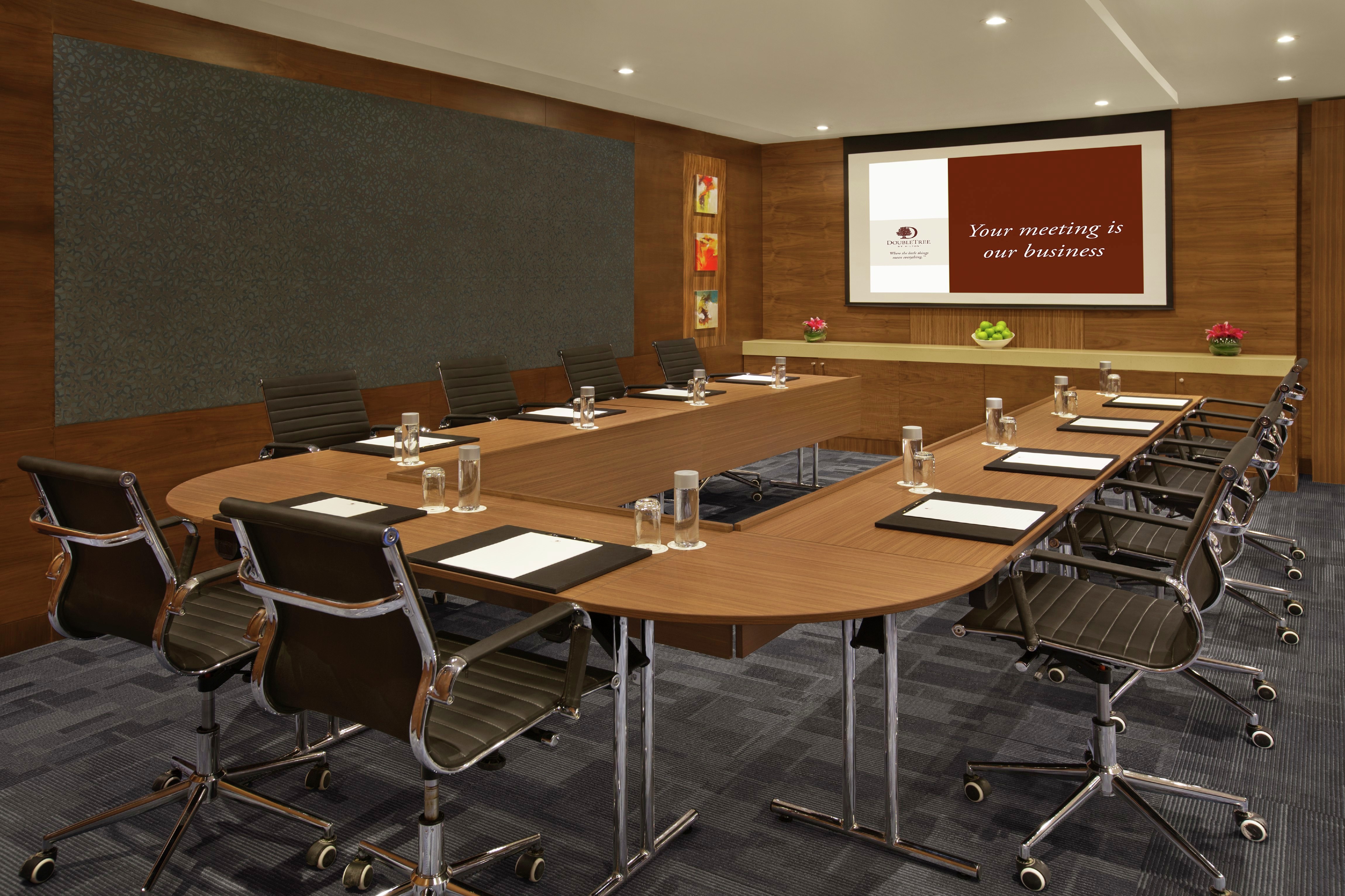 DoubleTree Meeting Room with U-Shaped Table, Chairs, and Room Technology