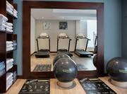 Fitness center with towels and cardio machines