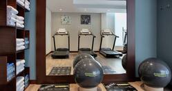 Fitness center with towels and cardio machines