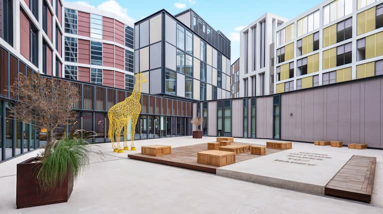 hotel courtyard seating, giraffe statue
