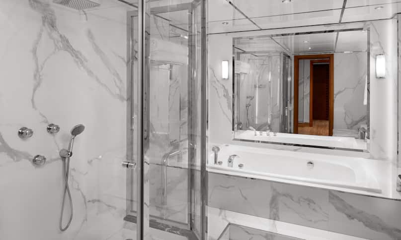 Mirror Bathtub and Separate Shower in Suite-previous-transition