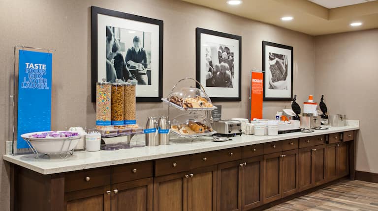 Breakfast Serving Area with Pastries and Waffle Makers