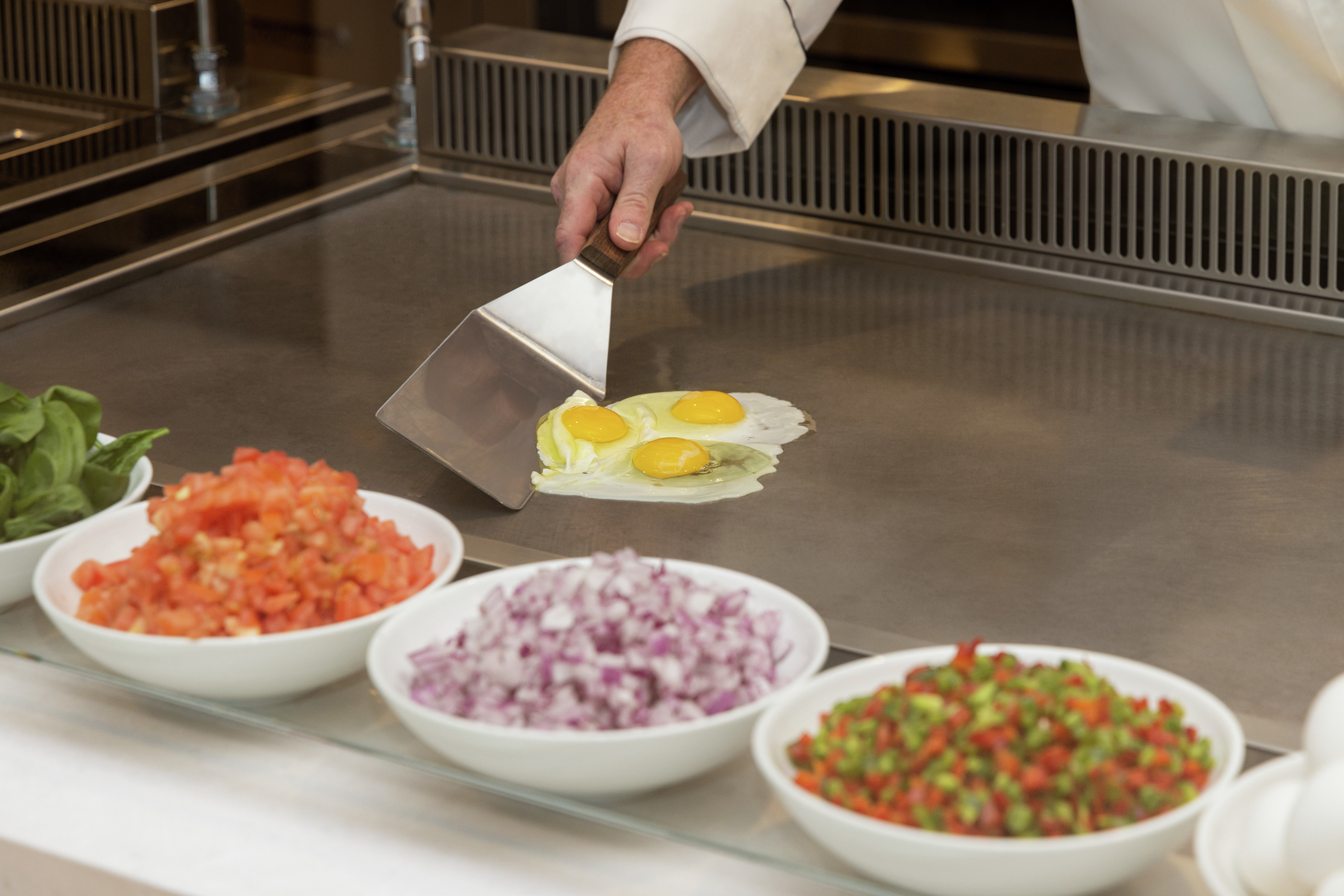 Detail of on-site omelet chef for daily morning breakfast offering
