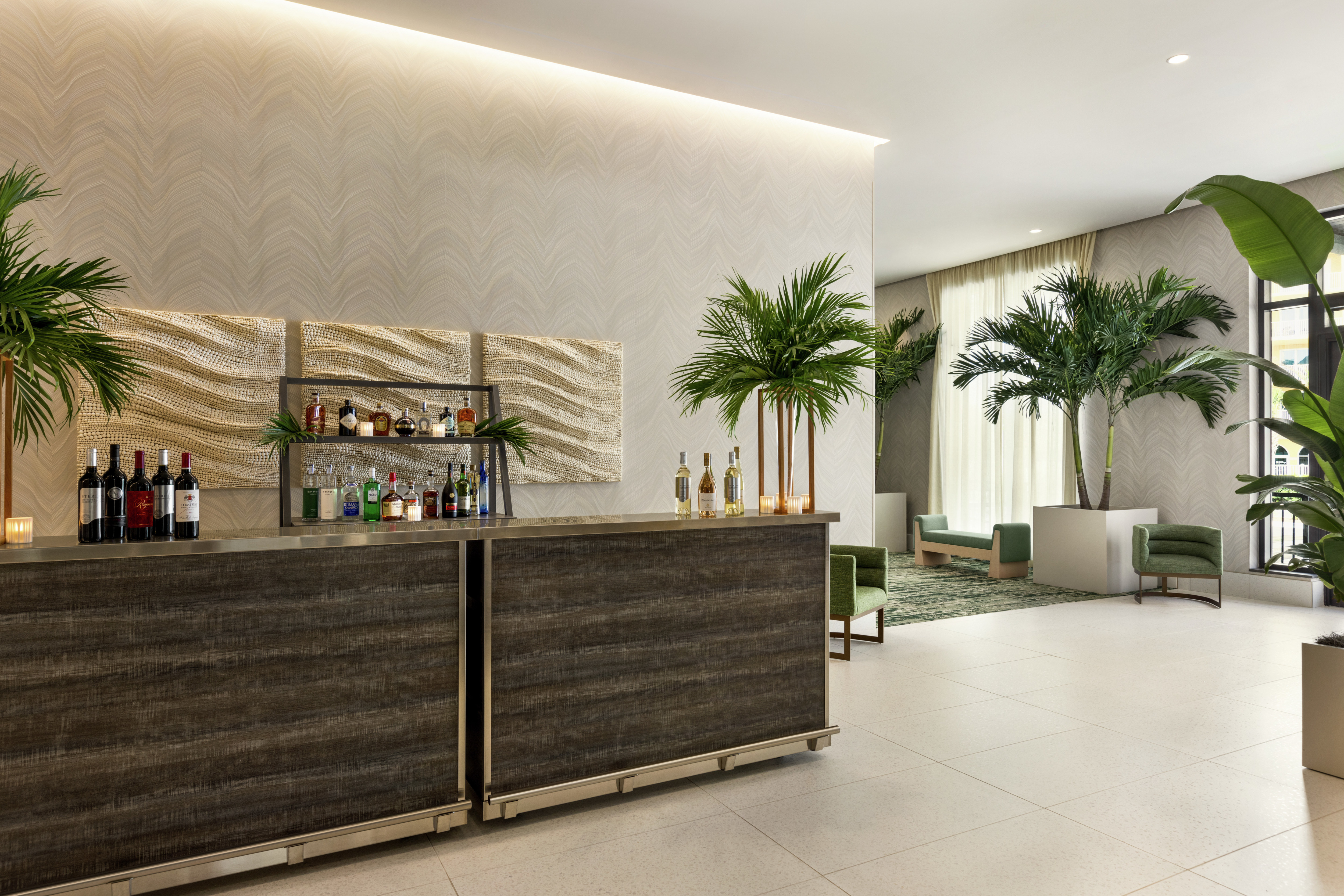 Convenient bar with stylish seating and lush greenery near meeting rooms for corporate and social events