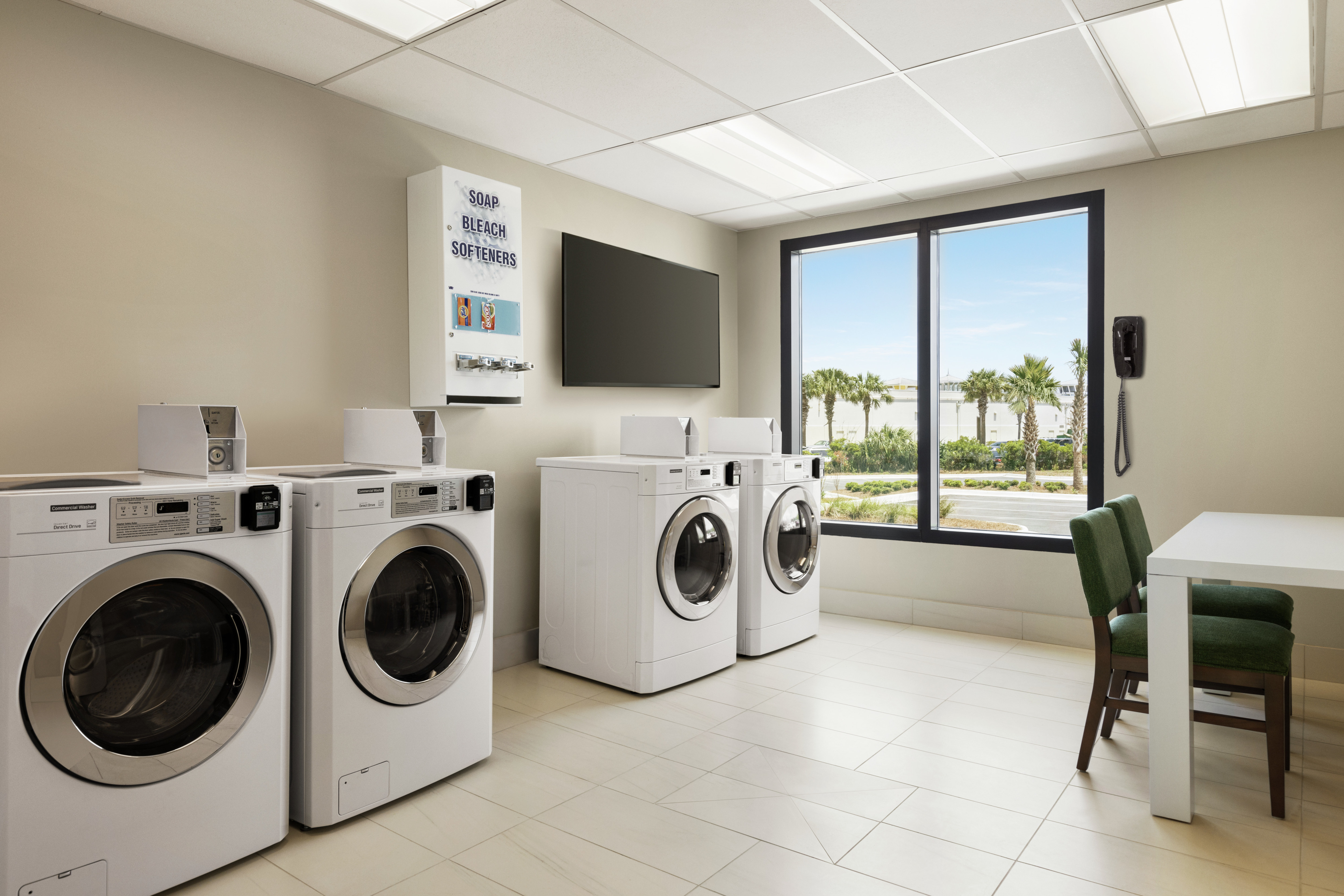 Convenient on-site guest laundry room with natural light