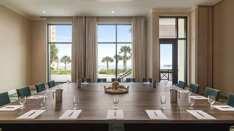 Convenient On-site meeting room featuring large boardroom table setup and ocean views