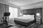 Comfortable King Bed featuring convenient in-room Peleton bike