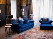 Sir Conan Doyle Suite Living Area with Blue Sofa and Armchair