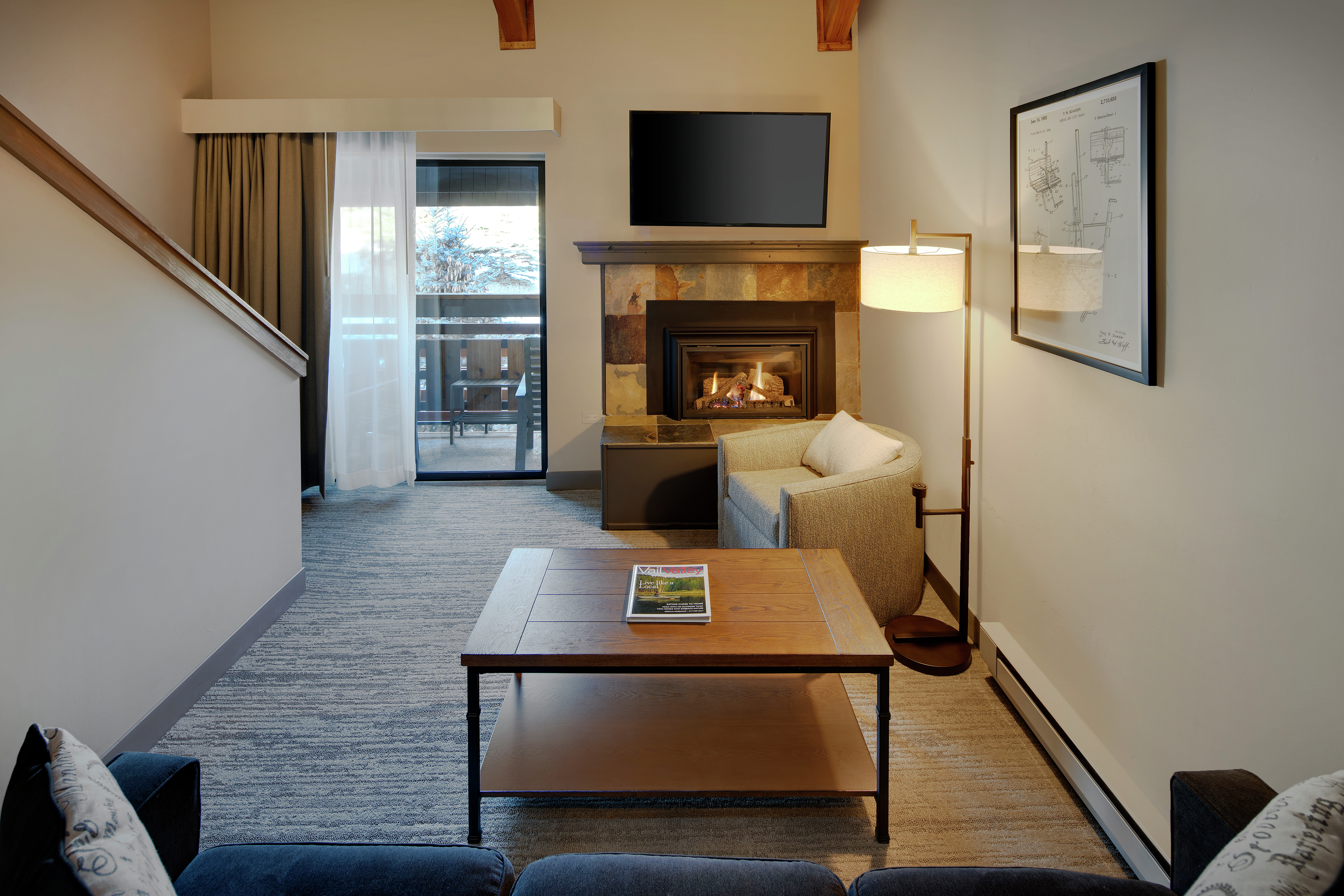Suite Living Area with TV and Fireplace