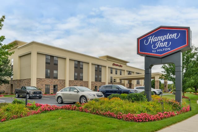Hotel Exterior with Hampton Sign, Landscaping and Parking