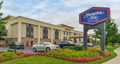 Hotel Exterior with Hampton Sign, Landscaping and Parking