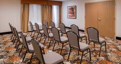 Rear View of Three Rows of Chairs Set Up in Meeting Room