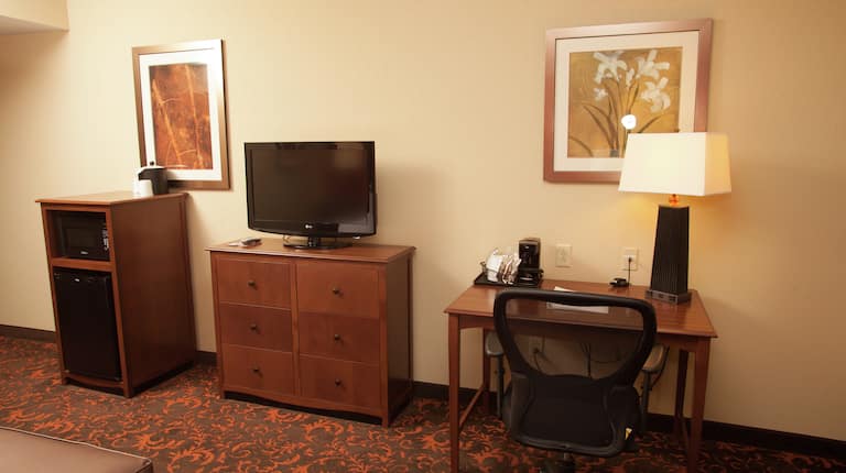 Microwave, Mini-Fridge, TV, and Work Desk with Chair in Guest Room
