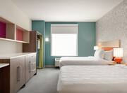Bright Studio Suite Featuring Double Queen Beds, Ample Storage, And Air Conditioning Unit By Window