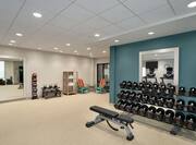 Convenient On-Site Fitness Center Fully Equipped With Free Weights And Exercise Machines