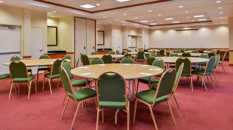 Meeting room with round tables and chairs