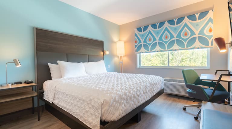 Guest Room with Large Bed and Work Desk